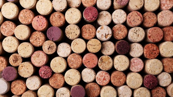 corks - some tinted red from red wine - to illustrate uncovering wine faults