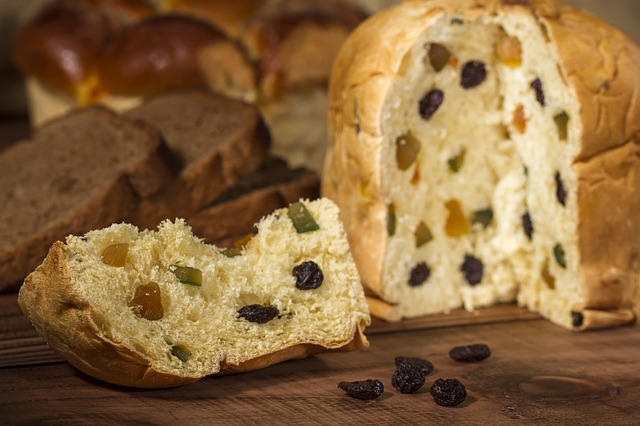 Panetonne cut into to reveal the dried fruit indide