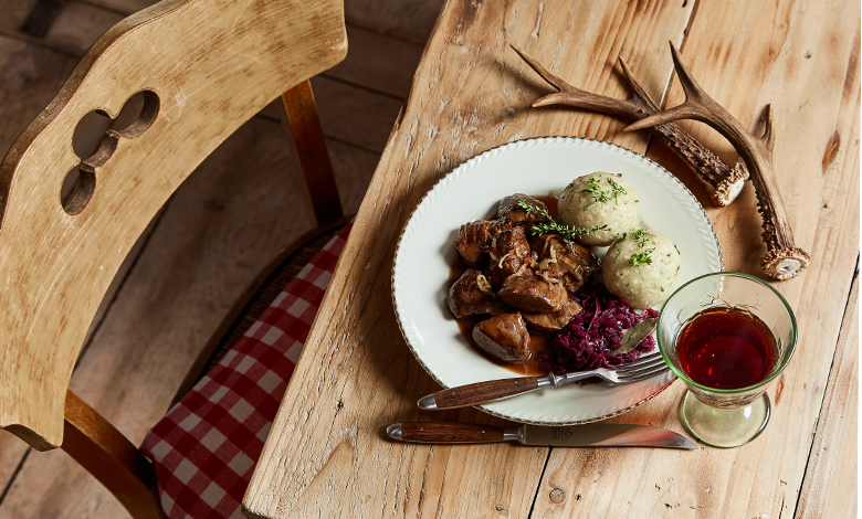 A hearty winter meal with a glass of wine 