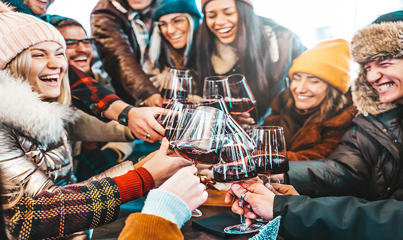 A group of people enjoying wine  at apres-ski