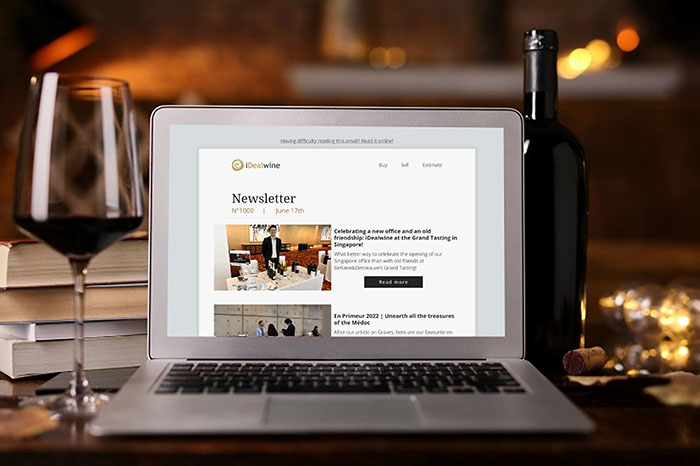 wine with laptop showing iDealwine's 1000th newsletter