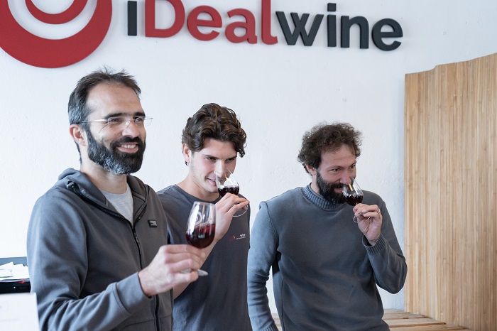 Members of the iDealwine team with a glass of wine