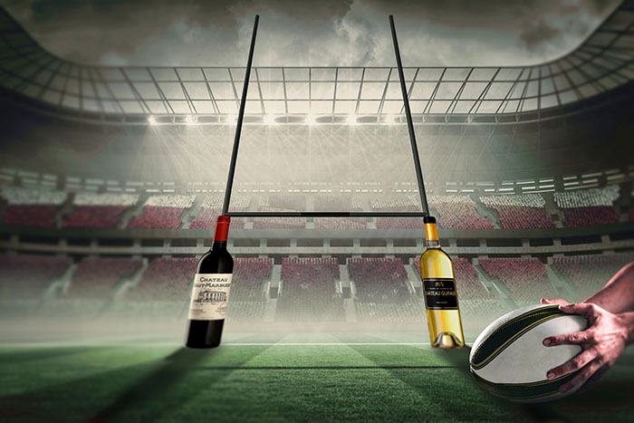 Rugby posts with wine bottles. Rugby world caip and wines and spirits