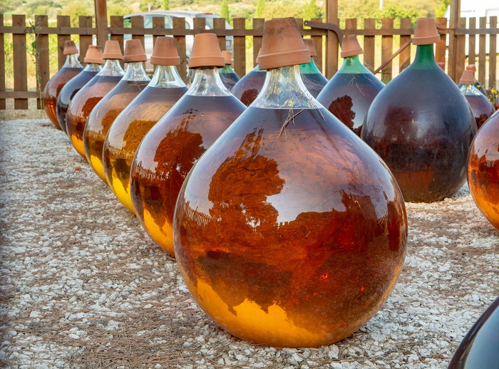 Vins Doux Naturels ageing in glass containers outside