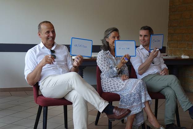 Cyrille, Angelique and Lionel competing in the quiz