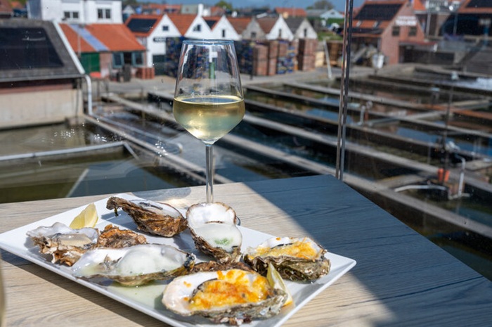 A glass of Chablis and oysters