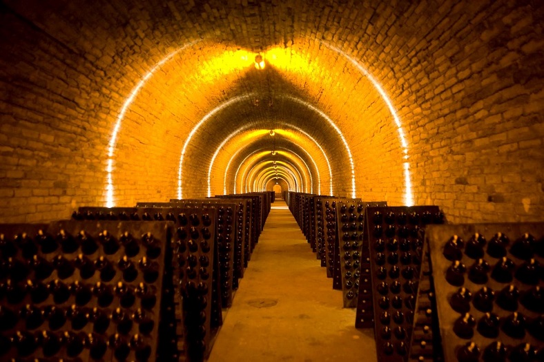 Bottles on the riddling rack in Krug Champagne cellars