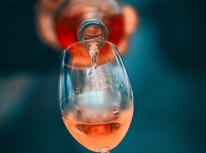 rosé being poured into a glass